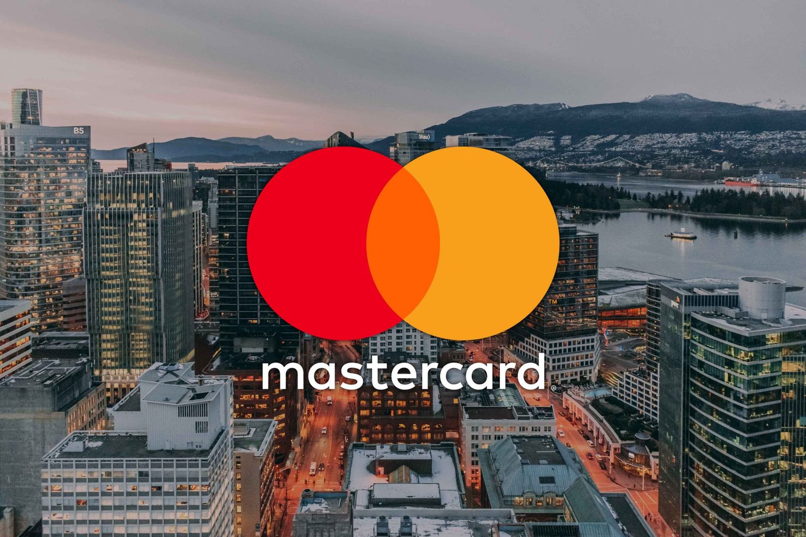 Mastercard — Mastercard logo over the Vancouver skyline